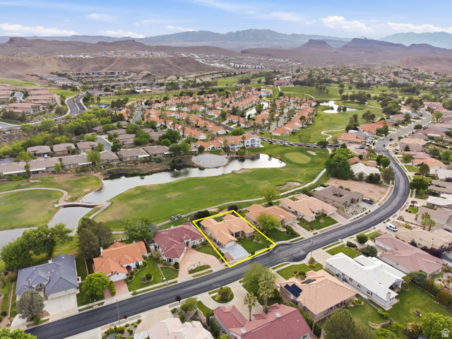 1985 West Rivers Edge Lane St. George, UT 84770 - Photo 8 of 42 Aerial perspective of suburban area featuring property parcel outlined, a water and mountain view, and a golf club