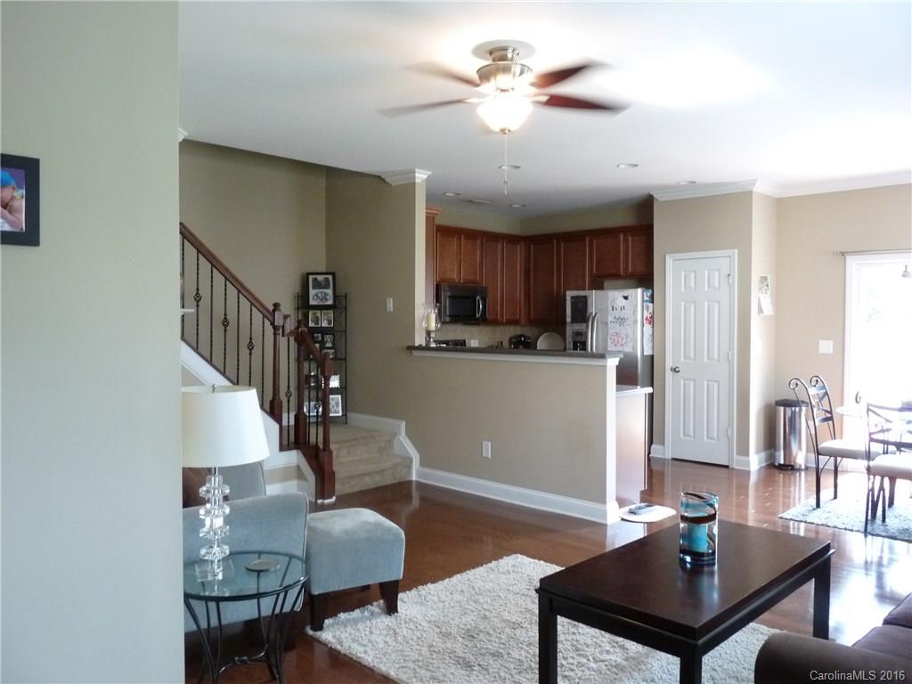 221 River Clay Road, Unit 183 Fort Mill, SC 29708 - Photo 2 of 20 a living room with furniture kitchen view and a chandelier