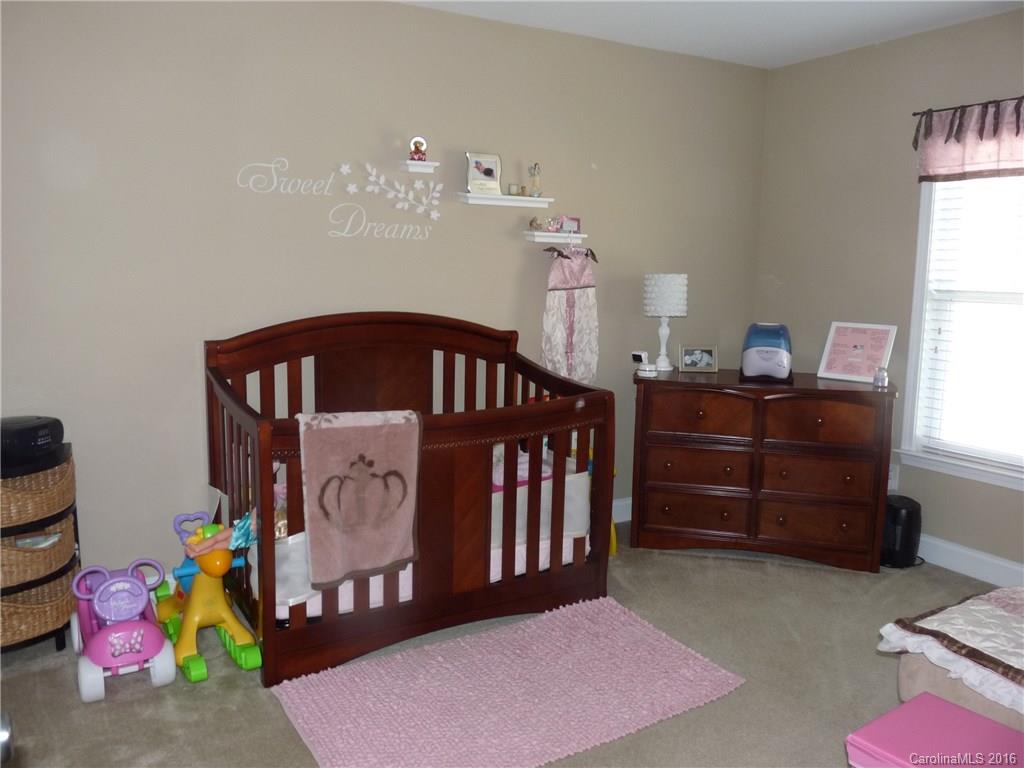 221 River Clay Road, Unit 183 Fort Mill, SC 29708 - Photo 14 of 20 a bedroom with furniture and a window