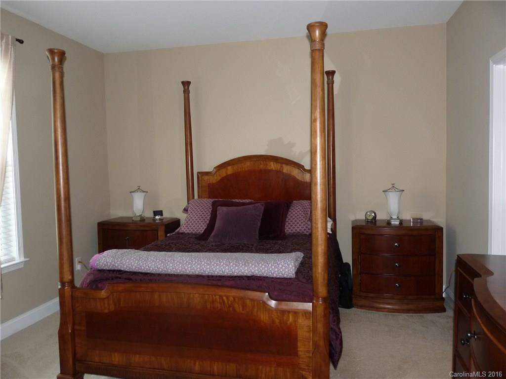 221 River Clay Road, Unit 183 Fort Mill, SC 29708 - Photo 7 of 20 a bedroom with a bed and a dresser