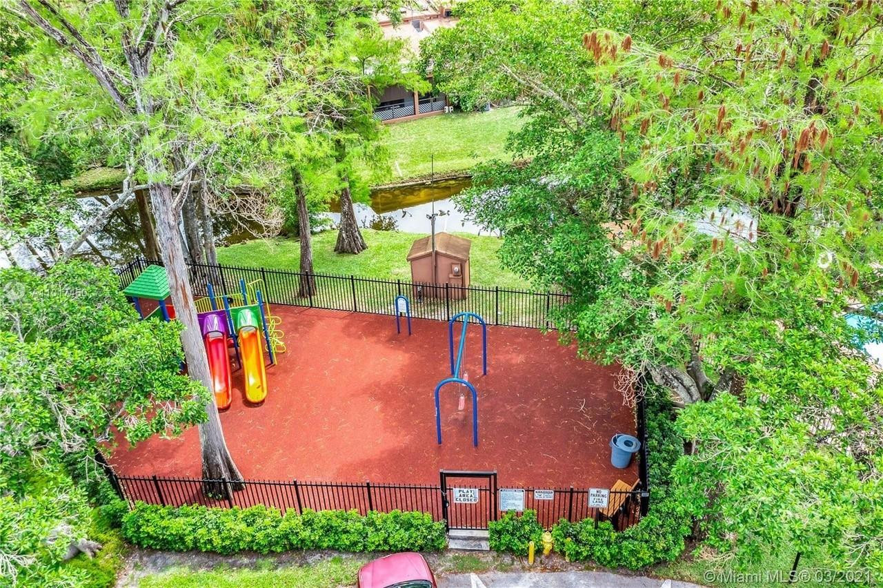 Undisclosed Address Tamarac, FL 33319 - Photo 20 of 21 an aerial view of a house with a yard and outdoor seating