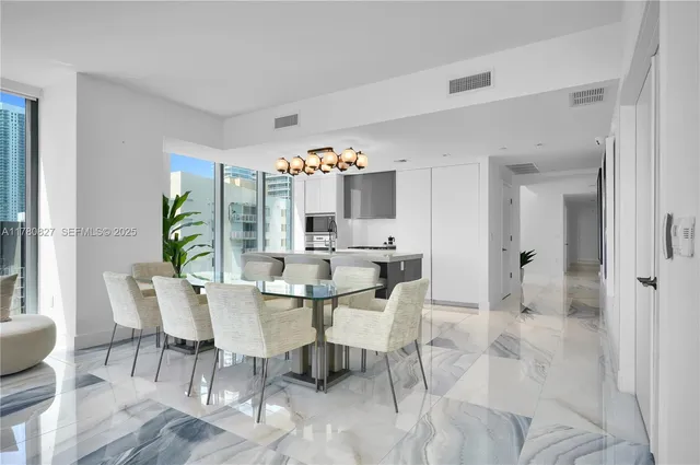 a kitchen with a sink and a stove top oven
