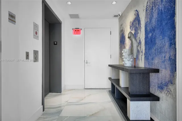 a living room with furniture and flowers