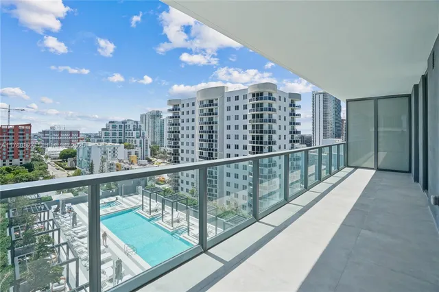 a view of swimming pool with outdoor seating