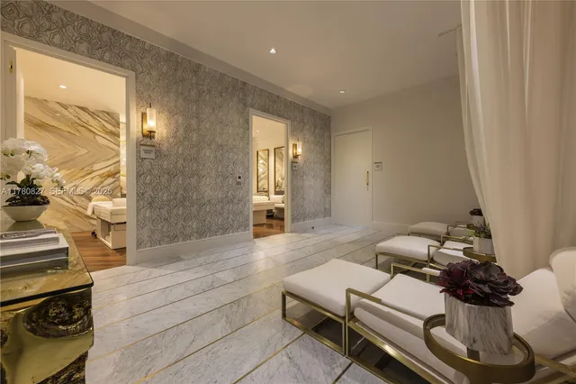 a living room with wooden floor and furniture