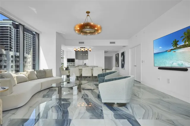 a living room with fireplace furniture and a flat screen tv