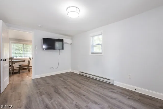 a view of livingroom with hardwood floor and window