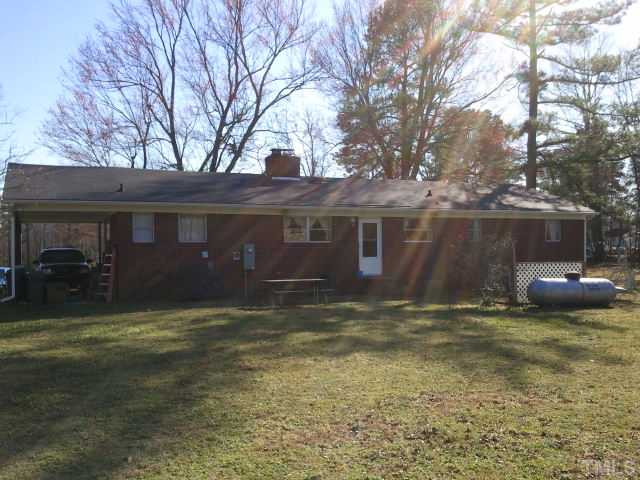 1421 Sykes Road Spring Hope, NC 27882 - Photo 2 of 11 a view of a house with a yard