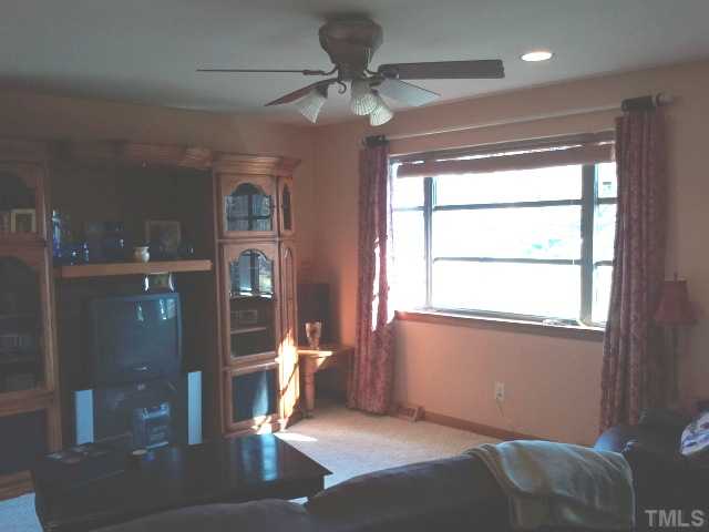 1421 Sykes Road Spring Hope, NC 27882 - Photo 5 of 11 a very nice looking room with a large window