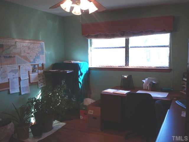 1421 Sykes Road Spring Hope, NC 27882 - Photo 8 of 11 a table with chairs and window