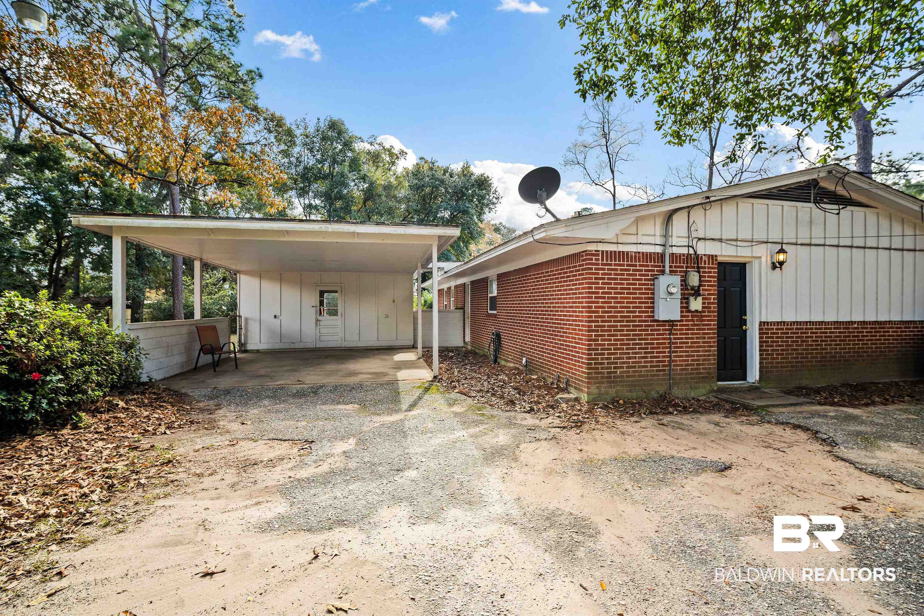 816 East Montfort Road Mobile, AL 36608 - Photo 22 of 24 View of side of property with a carport