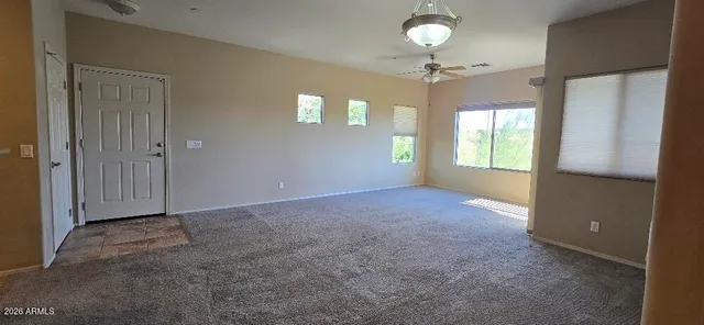 a kitchen with stainless steel appliances granite countertop a refrigerator a sink and a stove