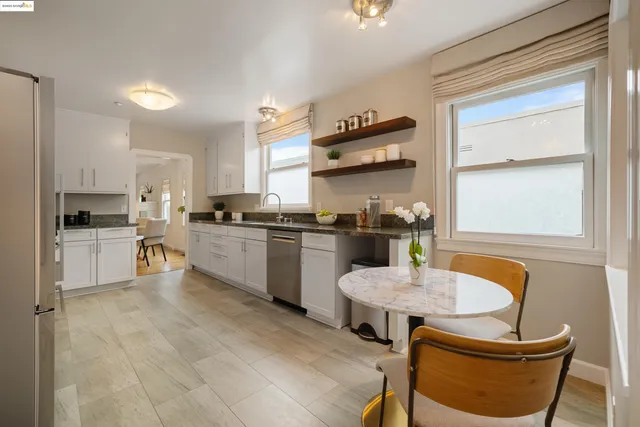 a kitchen with a table and chairs in it