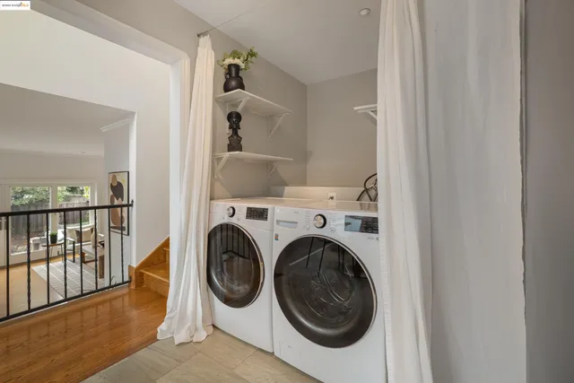 a view of a hallway with washer and dryer