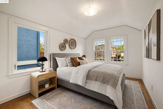 a bedroom with a bed and window