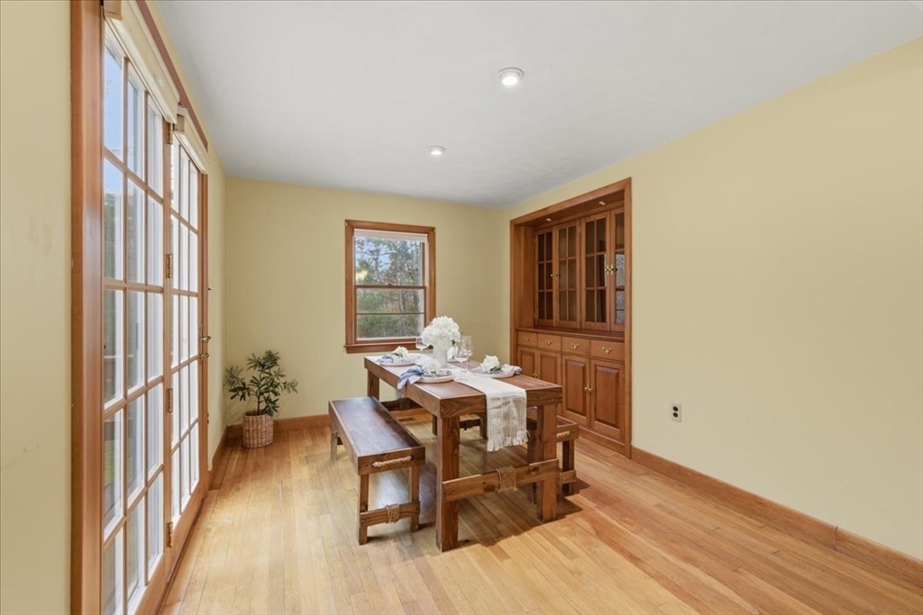 107 Oak Street Pembroke, MA 02359 - Photo 12 of 38 a view of a dining room with furniture and chandelier