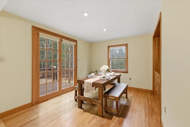 a workspace room with furniture and wooden floor