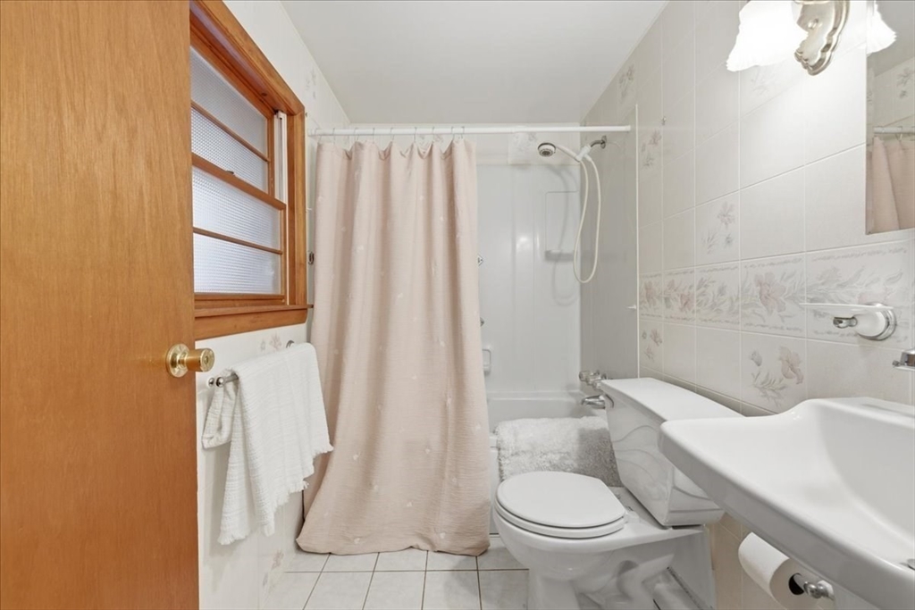 107 Oak Street Pembroke, MA 02359 - Photo 15 of 38 a bathroom with a toilet sink and shower