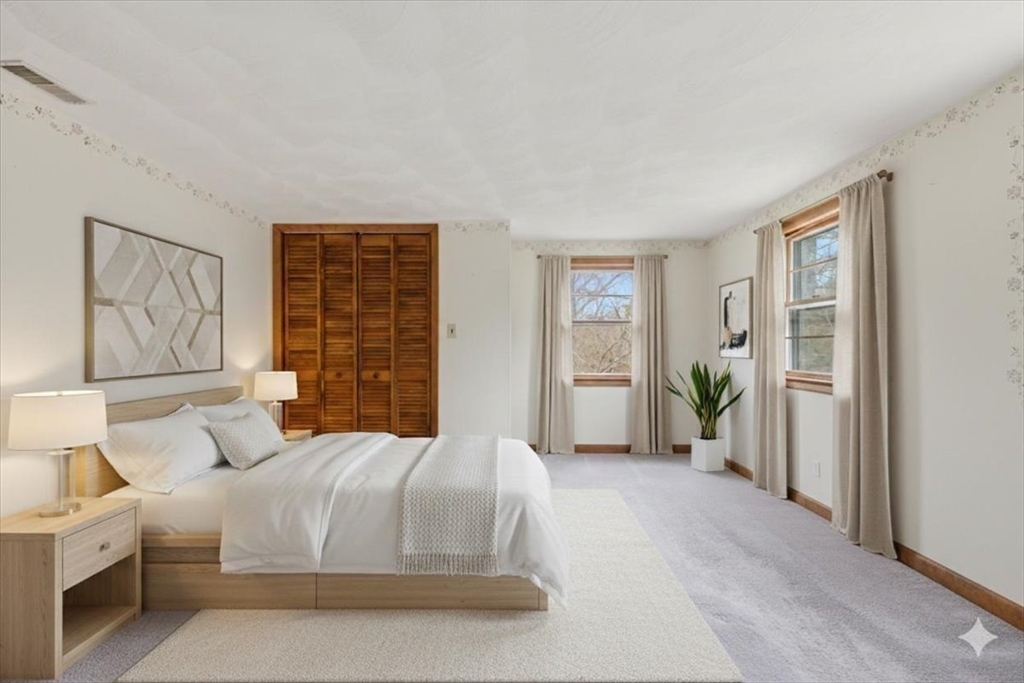 107 Oak Street Pembroke, MA 02359 - Photo 20 of 38 a bedroom with a large bed and a window