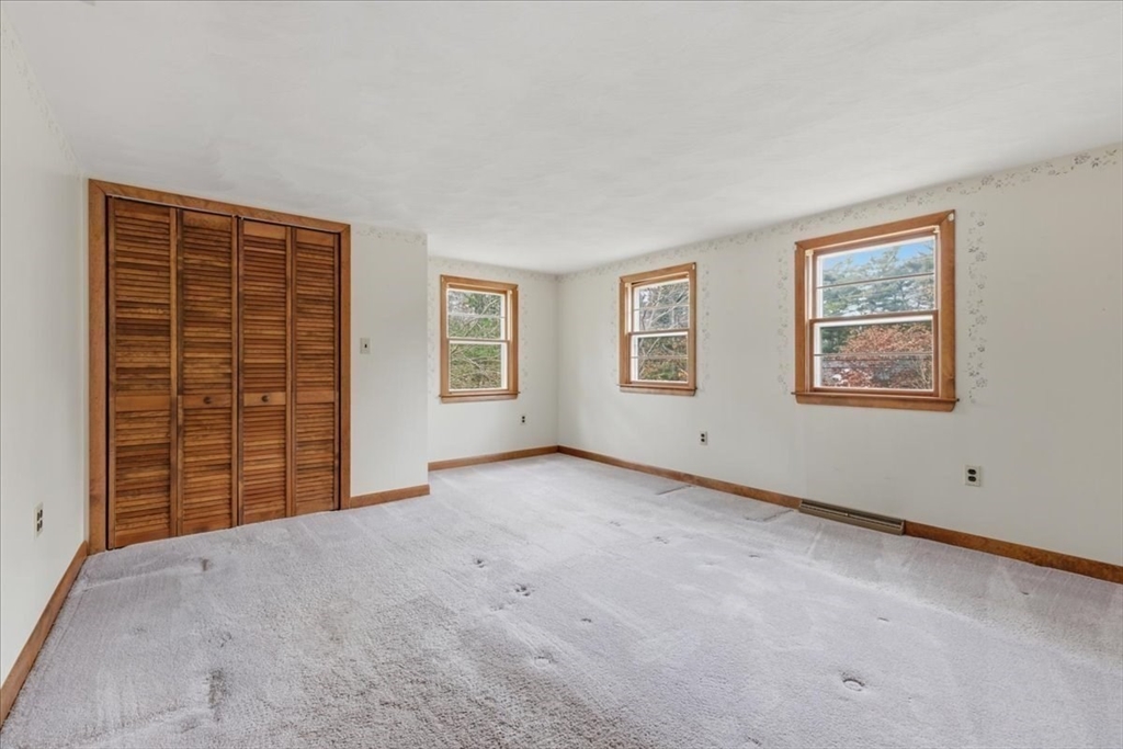 107 Oak Street Pembroke, MA 02359 - Photo 21 of 38 a view of an empty room with a window