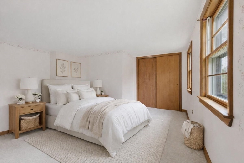 107 Oak Street Pembroke, MA 02359 - Photo 22 of 38 a bedroom with a bed next to a window