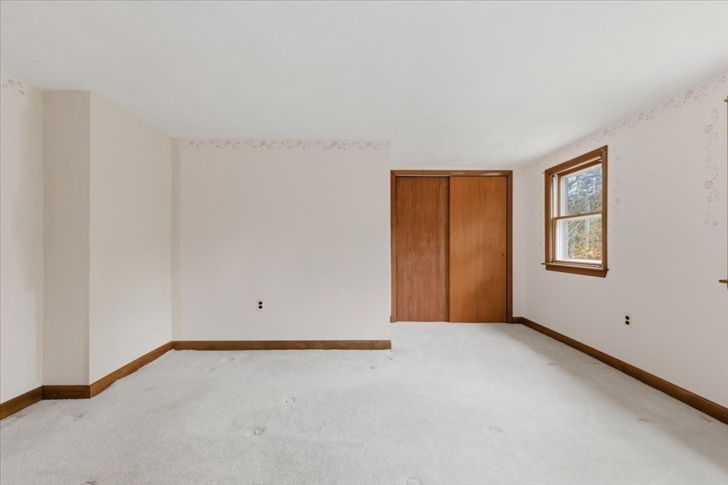 107 Oak Street Pembroke, MA 02359 - Photo 23 of 38 a view of an empty room with a window