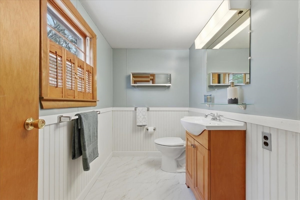 107 Oak Street Pembroke, MA 02359 - Photo 27 of 38 a bathroom with a sink a toilet and a shower