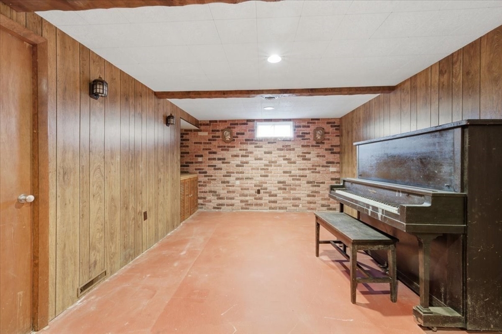 107 Oak Street Pembroke, MA 02359 - Photo 28 of 38 a view of an empty room with wooden floor