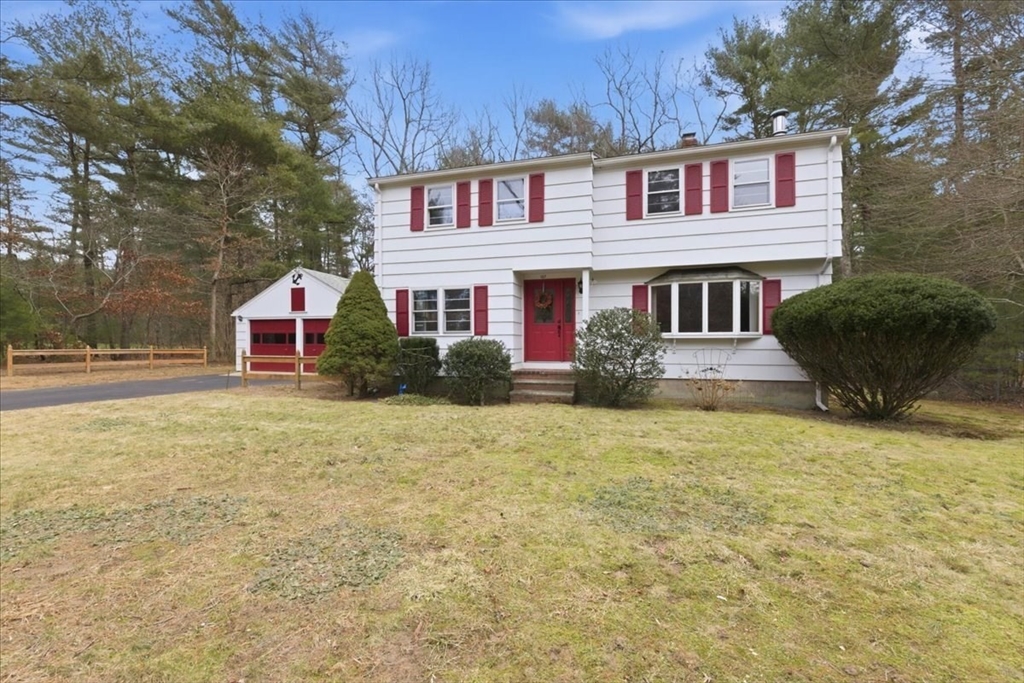 107 Oak Street Pembroke, MA 02359 - Photo 3 of 38 a front view of a house with large trees