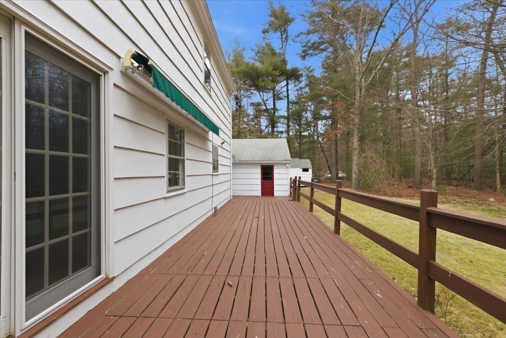 107 Oak Street Pembroke, MA 02359 - Photo 32 of 38 a view of balcony with wooden floor and fence