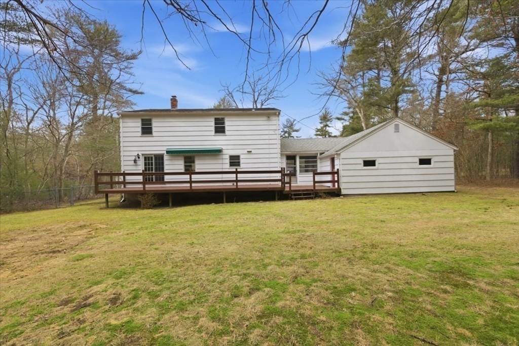 107 Oak Street Pembroke, MA 02359 - Photo 33 of 38 a front view of a house with a garden