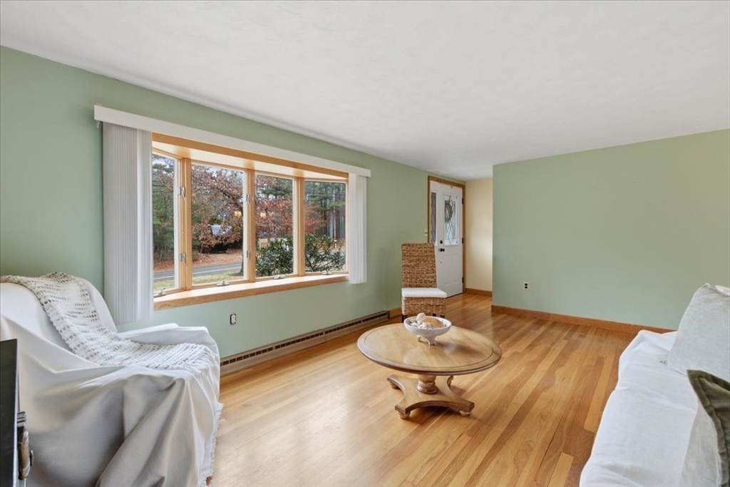 107 Oak Street Pembroke, MA 02359 - Photo 7 of 38 a living room with furniture and a table