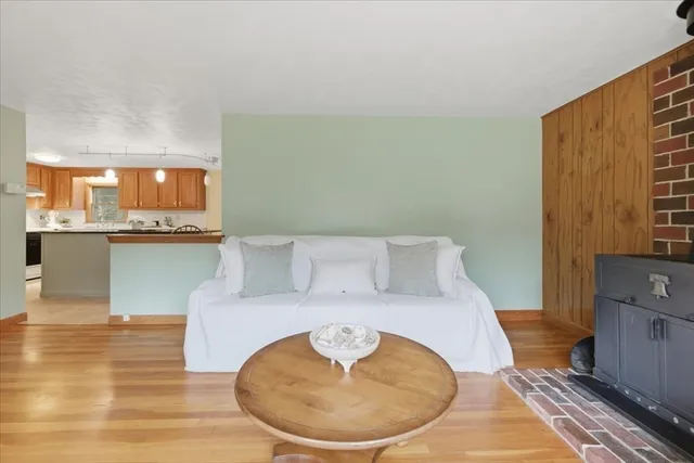 a living room with a couch and cabinets