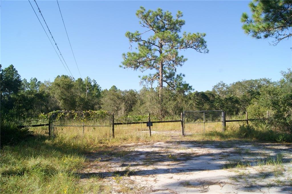2799 Re Byrd Road Frostproof, FL 33843 - Photo 1 of 1 a view of a lake with houses