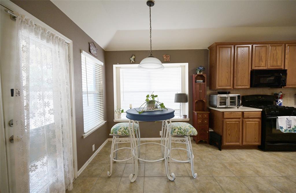 4509 Butterfly Way Fort Worth, TX 76244 - Photo 11 of 40 a kitchen with furniture a window and appliances