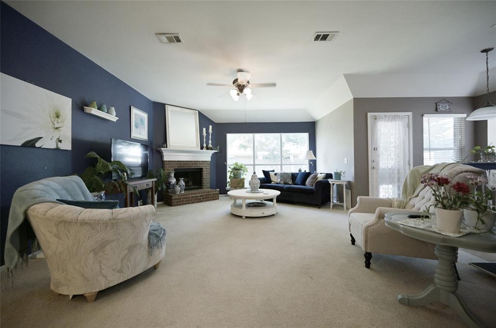 4509 Butterfly Way Fort Worth, TX 76244 - Photo 13 of 40 a living room with furniture and a fireplace