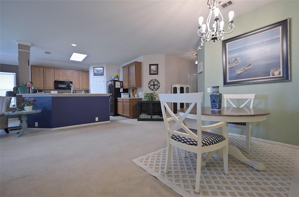 4509 Butterfly Way Fort Worth, TX 76244 - Photo 16 of 40 a living room with furniture and a chandelier