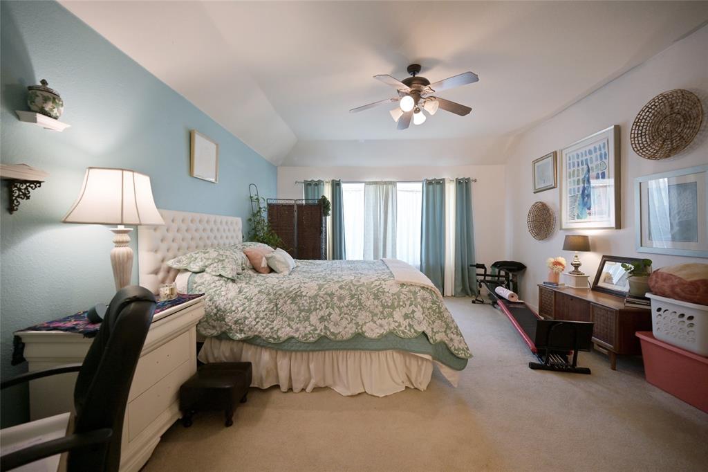 4509 Butterfly Way Fort Worth, TX 76244 - Photo 19 of 40 a bedroom with bed and a chandelier