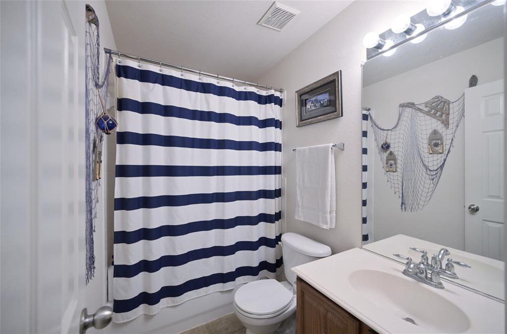 4509 Butterfly Way Fort Worth, TX 76244 - Photo 26 of 40 a bathroom with a sink toilet and shower