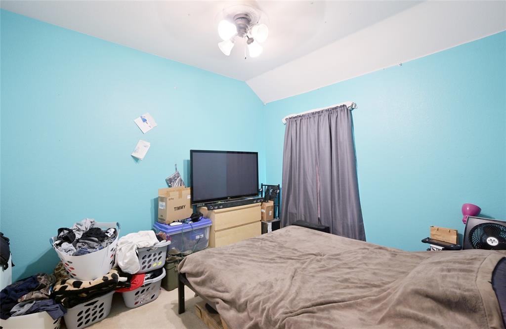 4509 Butterfly Way Fort Worth, TX 76244 - Photo 27 of 40 a bedroom with bed and a flat tv screen on dresser