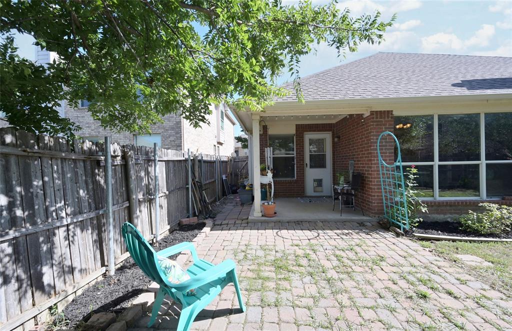 4509 Butterfly Way Fort Worth, TX 76244 - Photo 30 of 40 a view of a dinning table and chairs in patio