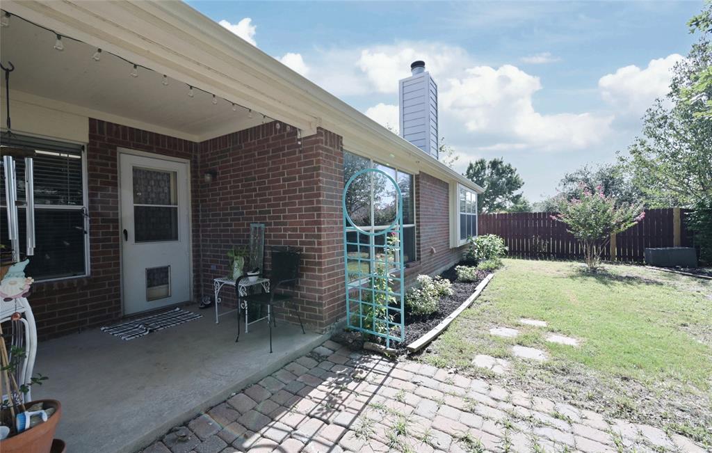 4509 Butterfly Way Fort Worth, TX 76244 - Photo 31 of 40 a backyard of a house with yard and outdoor seating