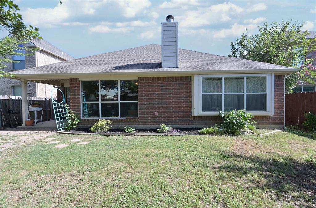 4509 Butterfly Way Fort Worth, TX 76244 - Photo 33 of 40 a front view of a house with garden