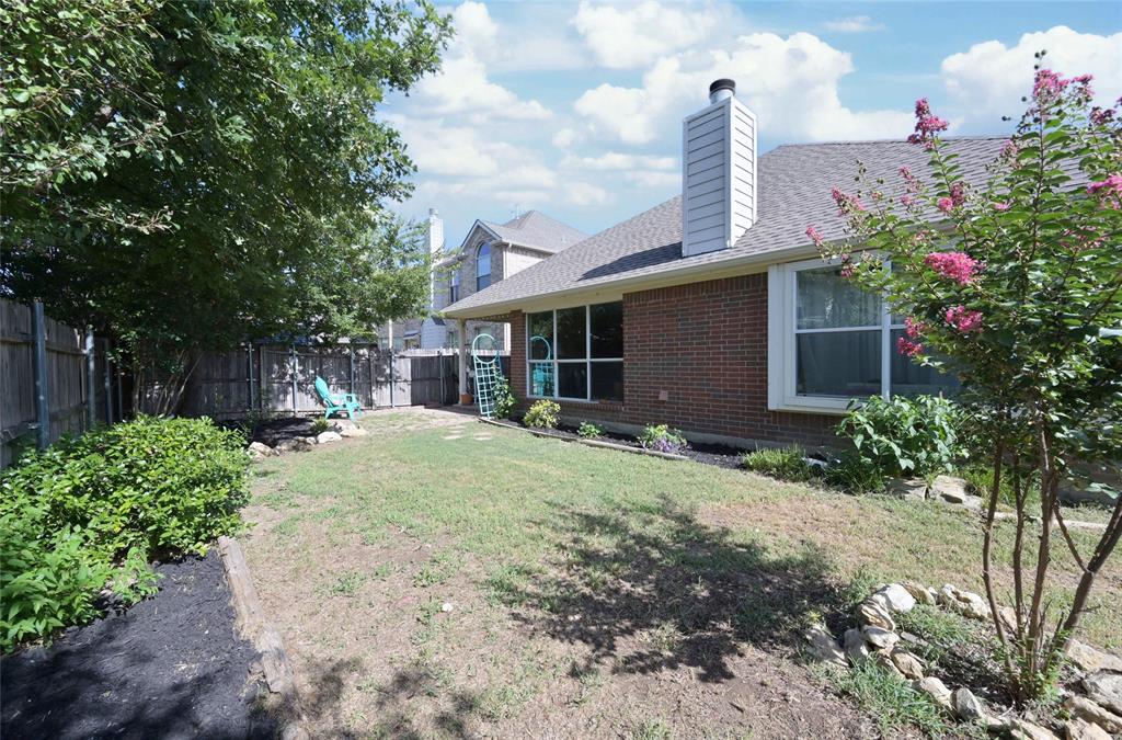 4509 Butterfly Way Fort Worth, TX 76244 - Photo 35 of 40 a front view of a house with garden