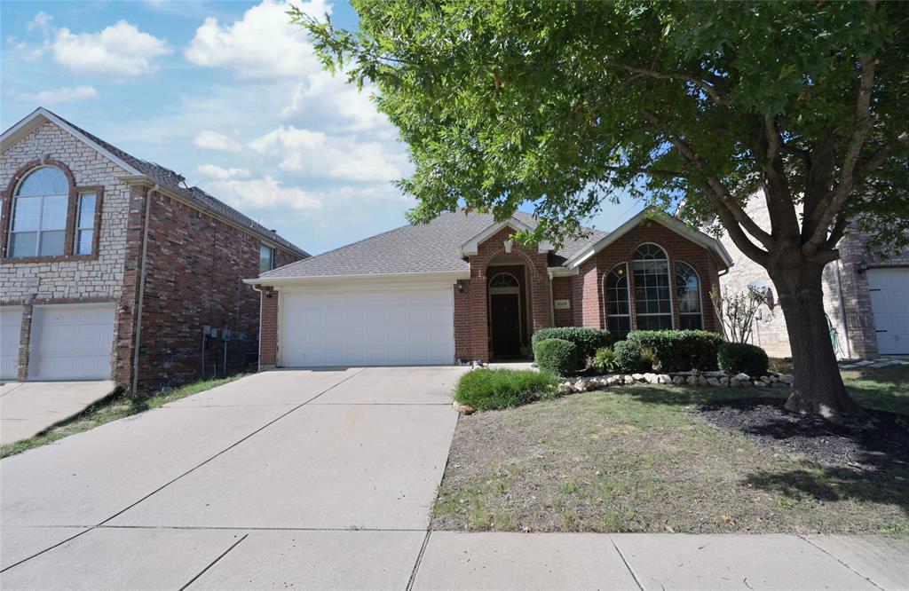 4509 Butterfly Way Fort Worth, TX 76244 - Photo 36 of 40 a front view of a house with garden