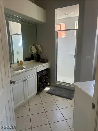 a bathroom with a sink a vanity and a mirror