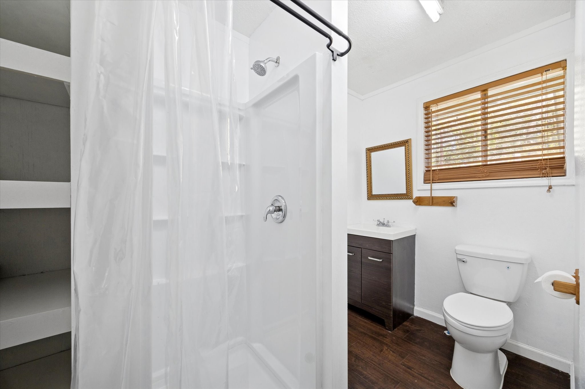 6219 Masters Manvel, TX 77578 - Photo 8 of 10 a white toilet sitting next to a bathroom sink