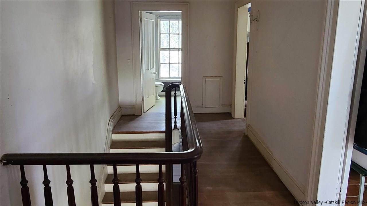 9 Dock Road Milton, NY 12547 - Photo 19 of 30 a view of a hallway with wooden floor and stairs