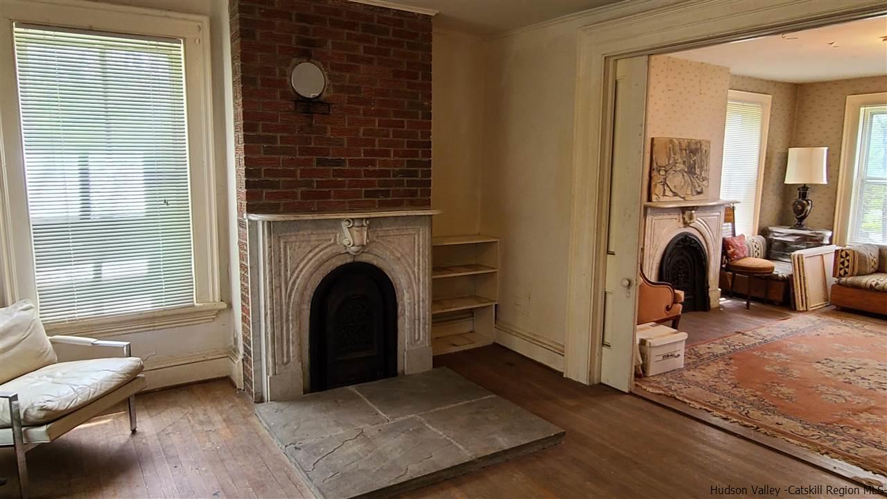 9 Dock Road Milton, NY 12547 - Photo 9 of 30 a living room with furniture a large window and a fireplace
