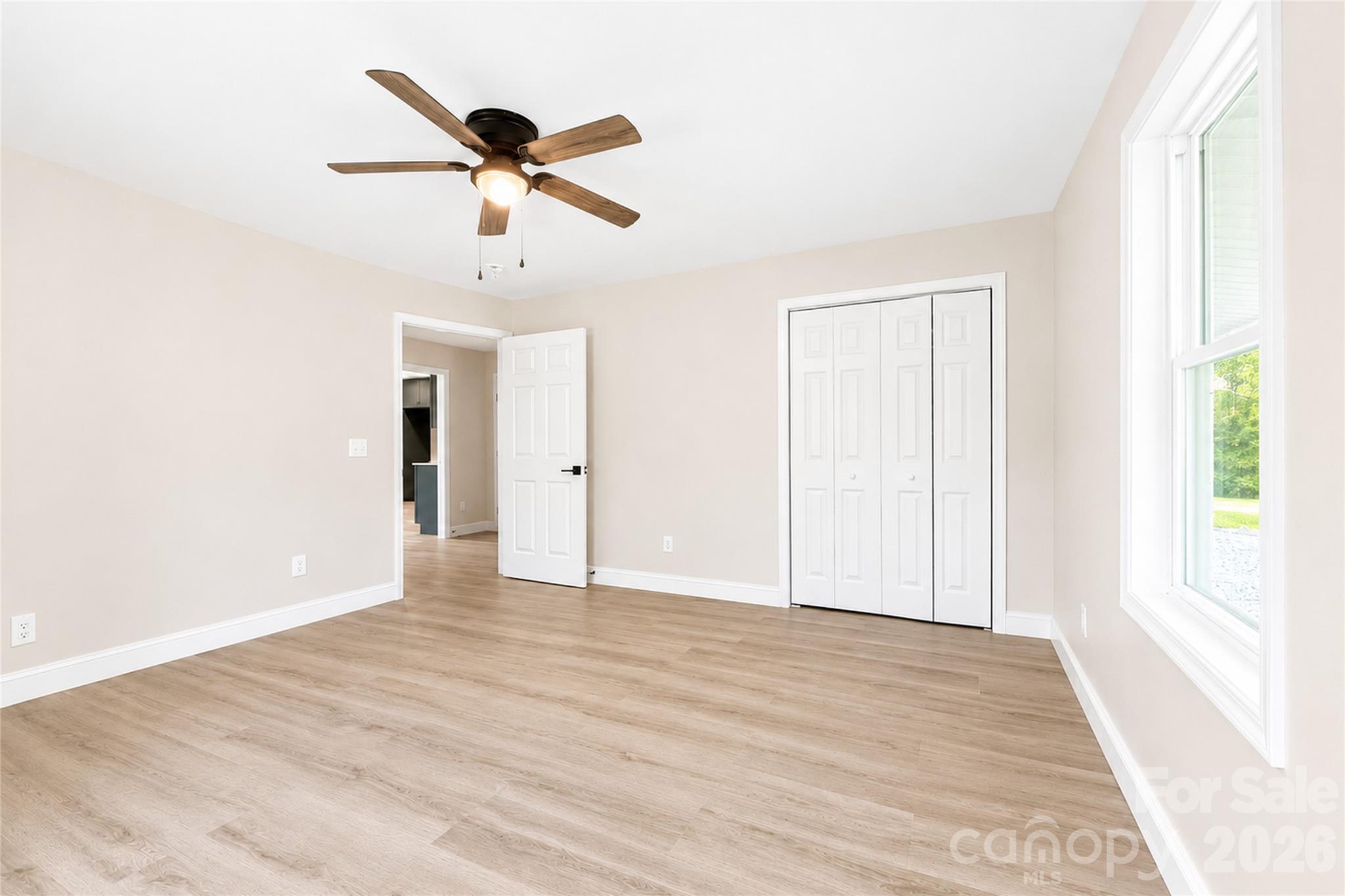 1403 Dudley Shoals Road Granite Falls, NC 28630 - Photo 20 of 34 a view of empty room with wooden floor and ceiling fan